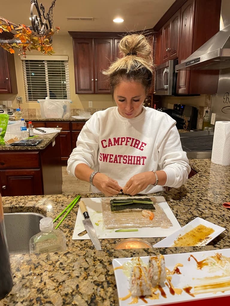 Hands-on sushi class with guests rolling together